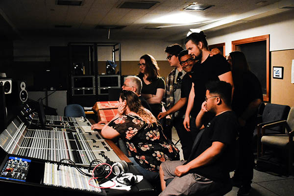 Director of commercial music Jeff Forehan (center) and students working with the new Audient desk at West Valley College.
