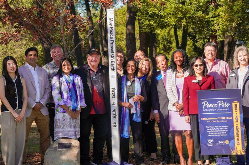 saratoga rotary club, city representatives and west valley college leadership pictured behind the peace pole
