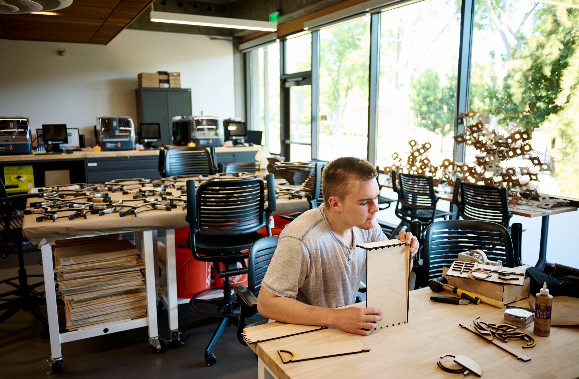 student making models with laser cut cardboard