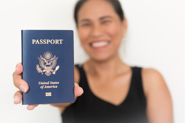 Happy human holding passport