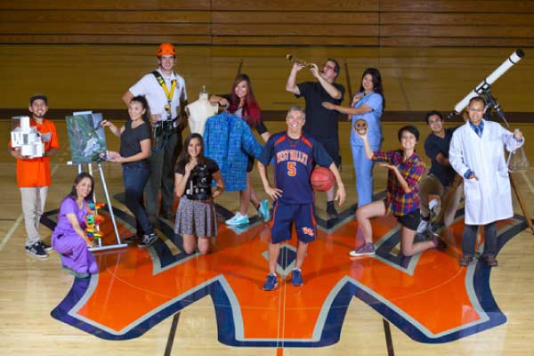 Brad with students in gym