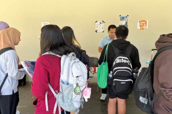 A group of people wearing backpacks.