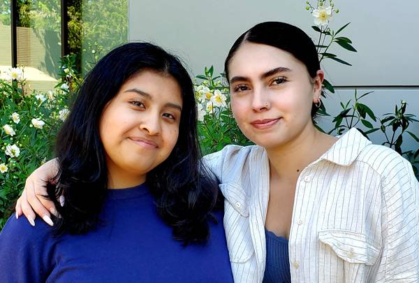 two female students smiling