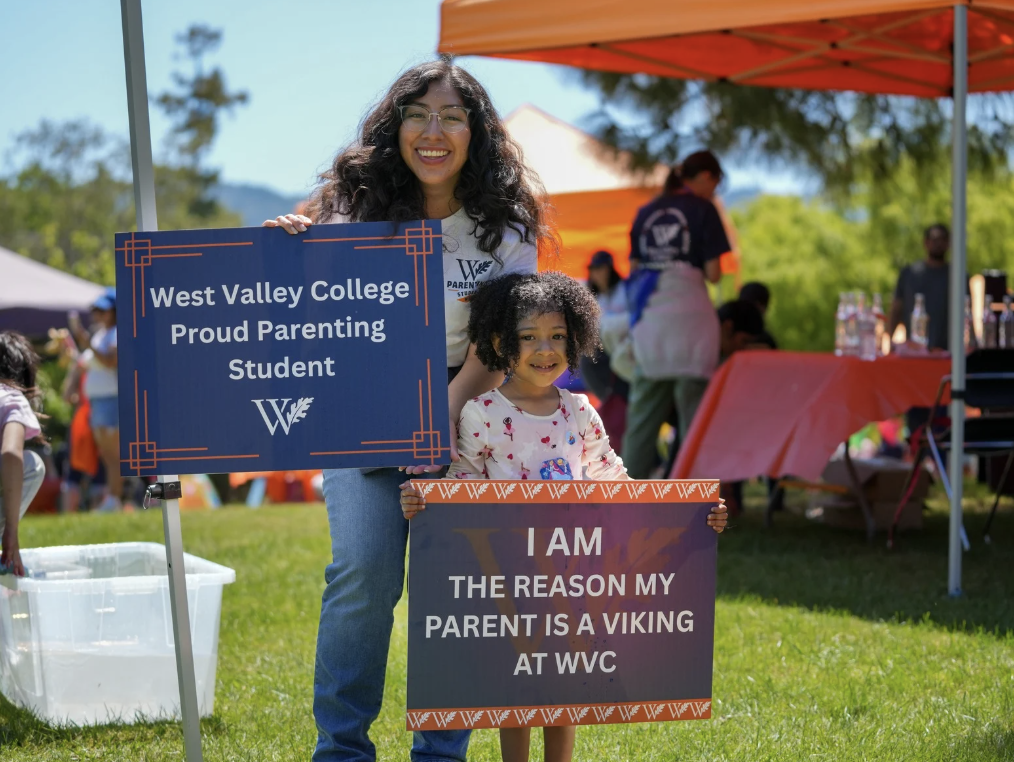 student parent with their kid at wvc event